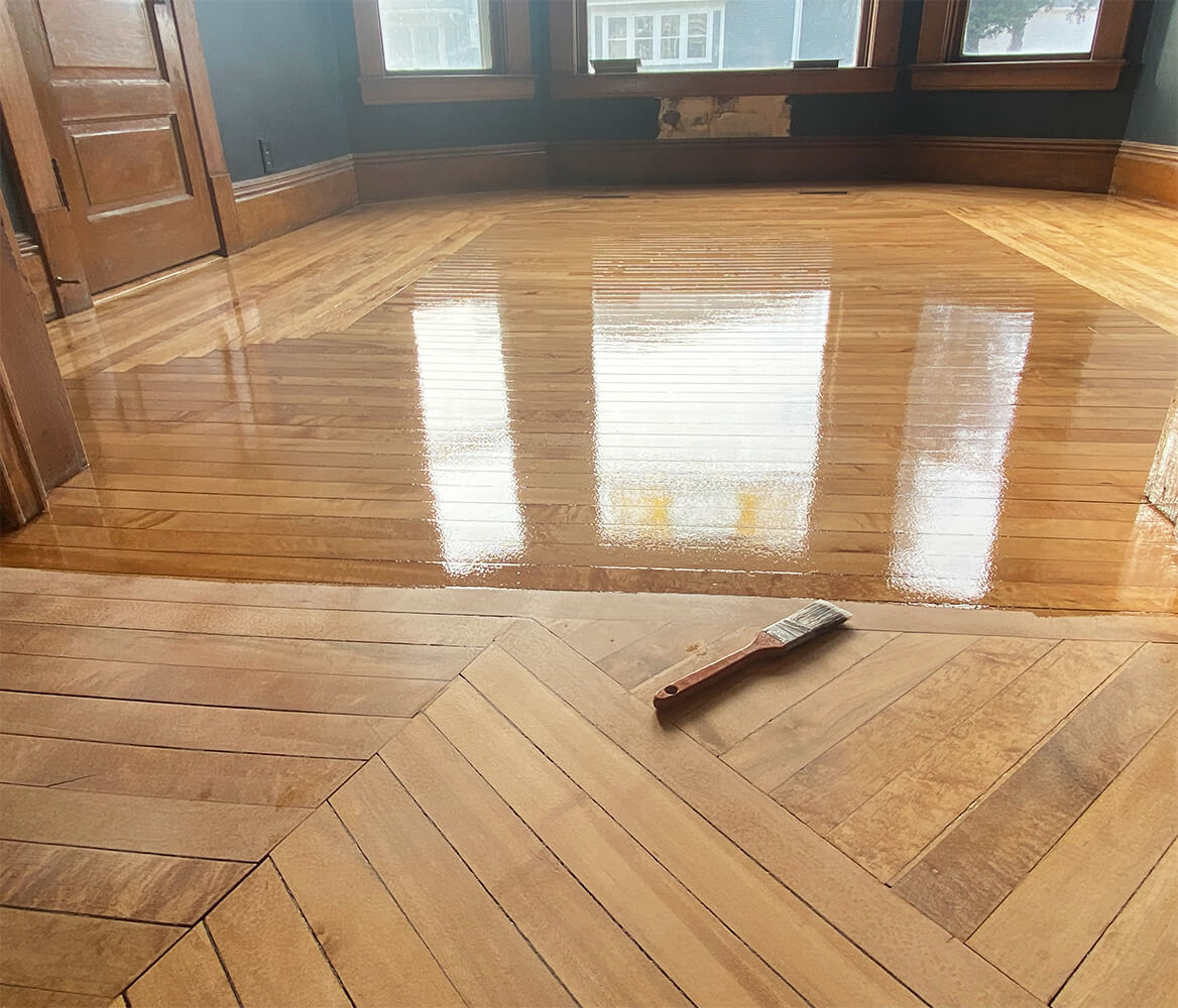 Applying finish on Maple floor